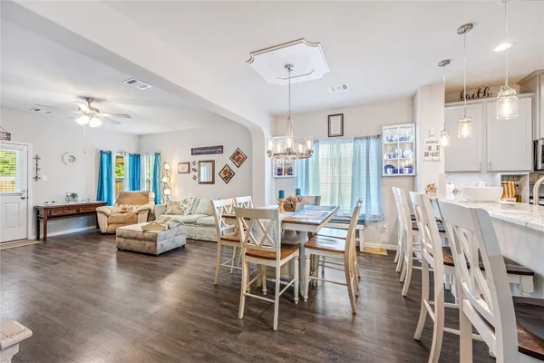 a view of a dining room with furniture and wooden floor