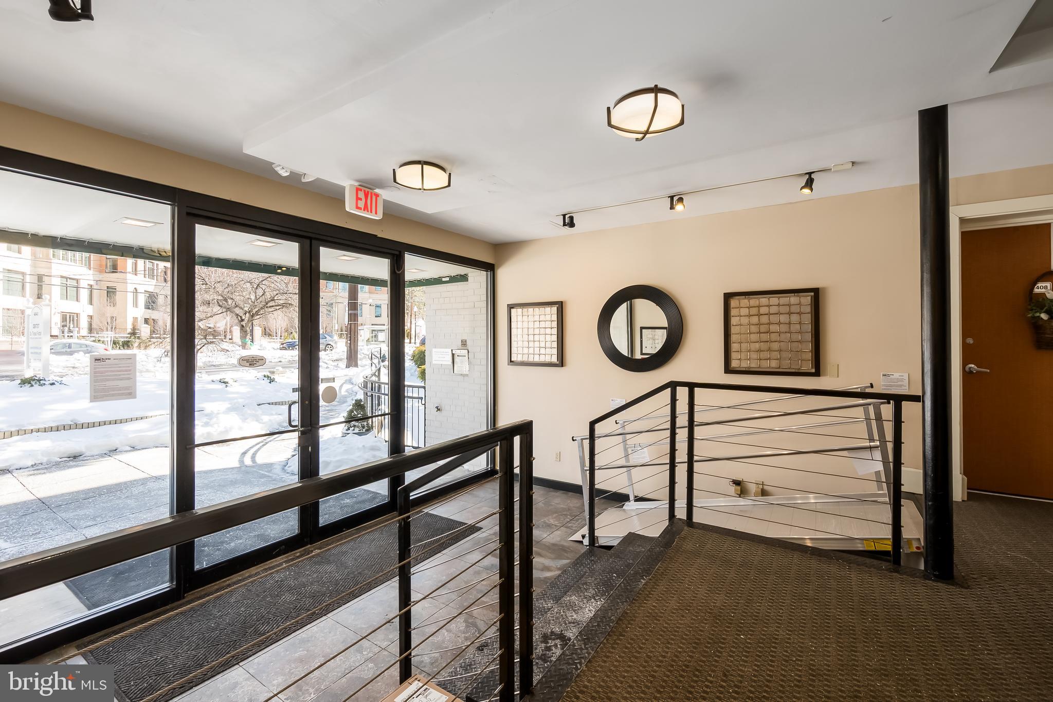 4840 MacArthur Boulevard Northwest, Unit 307 Washington, DC 20007 - Photo 2 of 21 a view of a hallway with washer and dryer