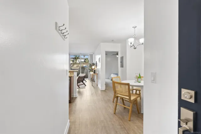 an entryway of a house with wooden floor