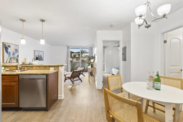 a view of a kitchen and dining table chairs