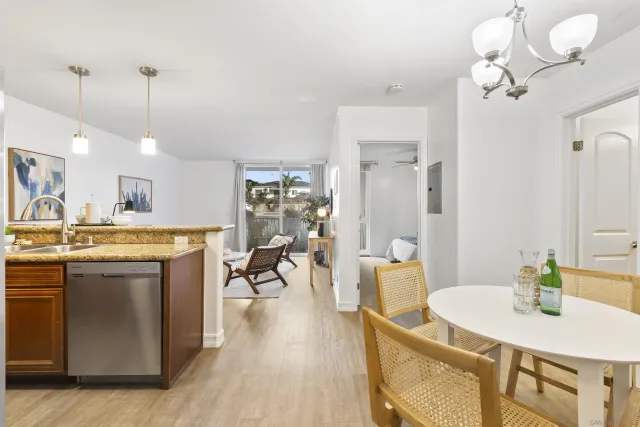 a view of a kitchen and dining table chairs