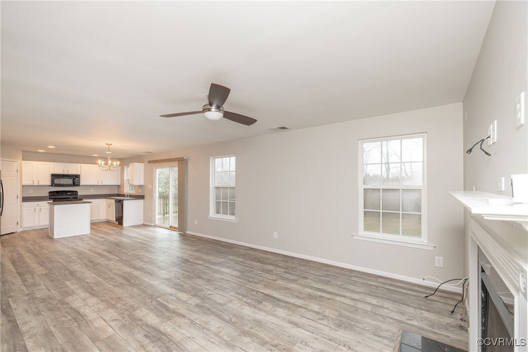5125 Glenbeigh Road Richmond, VA 23234 - Photo 11 of 40 a view of empty room with wooden floor and window
