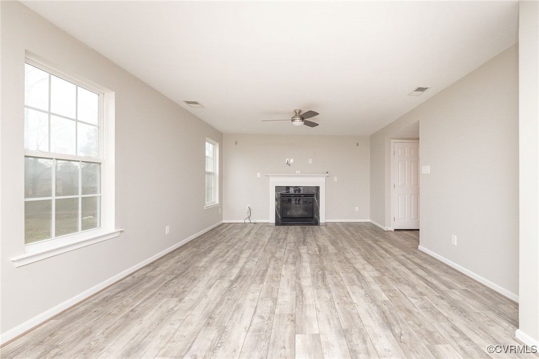 5125 Glenbeigh Road Richmond, VA 23234 - Photo 12 of 40 an empty room with windows