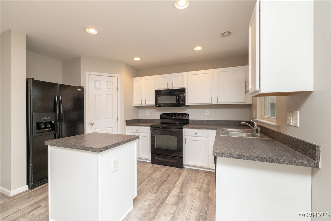 5125 Glenbeigh Road Richmond, VA 23234 - Photo 15 of 40 a kitchen with a sink a stove a refrigerator and a microwave