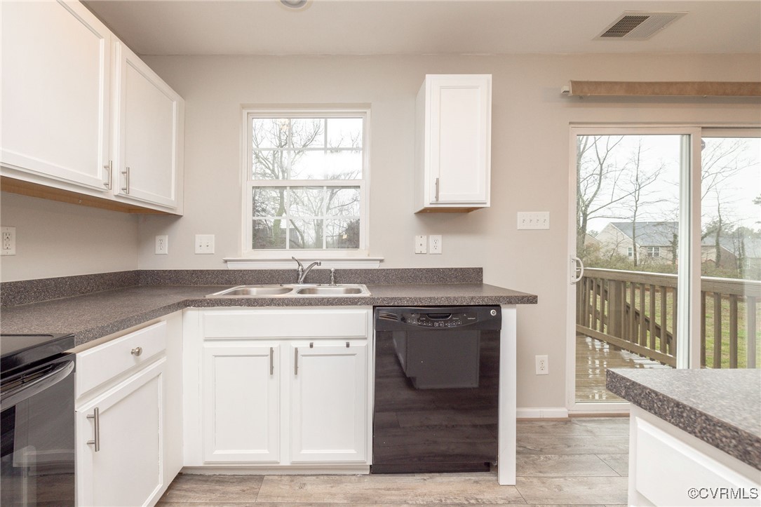 5125 Glenbeigh Road Richmond, VA 23234 - Photo 16 of 40 a kitchen with granite countertop a sink stove and cabinets