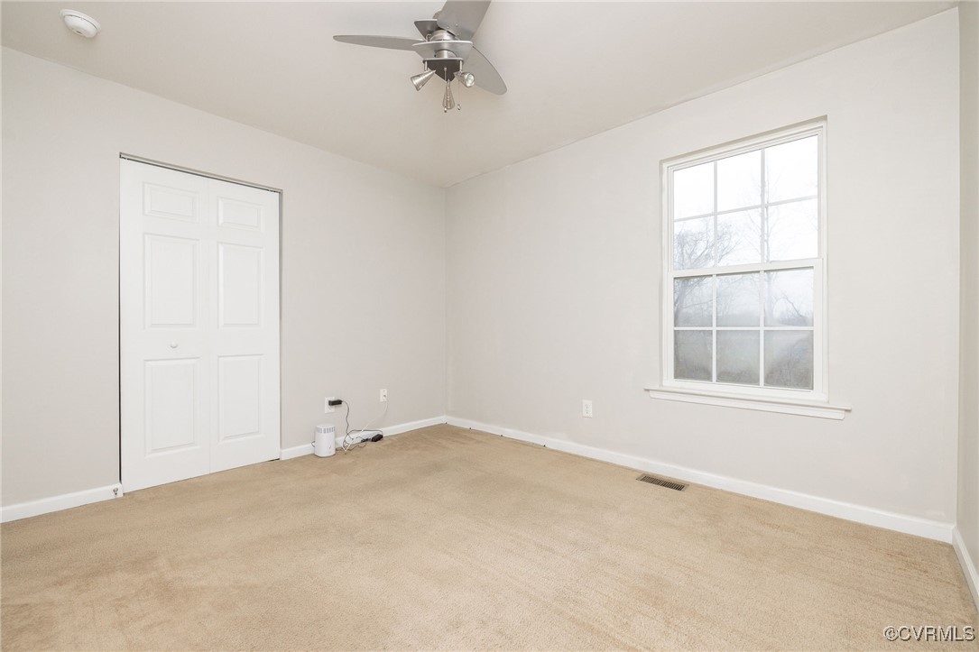 5125 Glenbeigh Road Richmond, VA 23234 - Photo 21 of 40 an empty room with a window