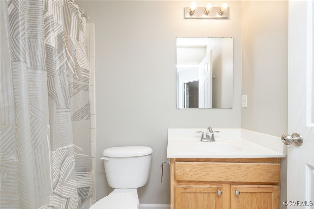 5125 Glenbeigh Road Richmond, VA 23234 - Photo 22 of 40 a bathroom with a sink toilet and mirror