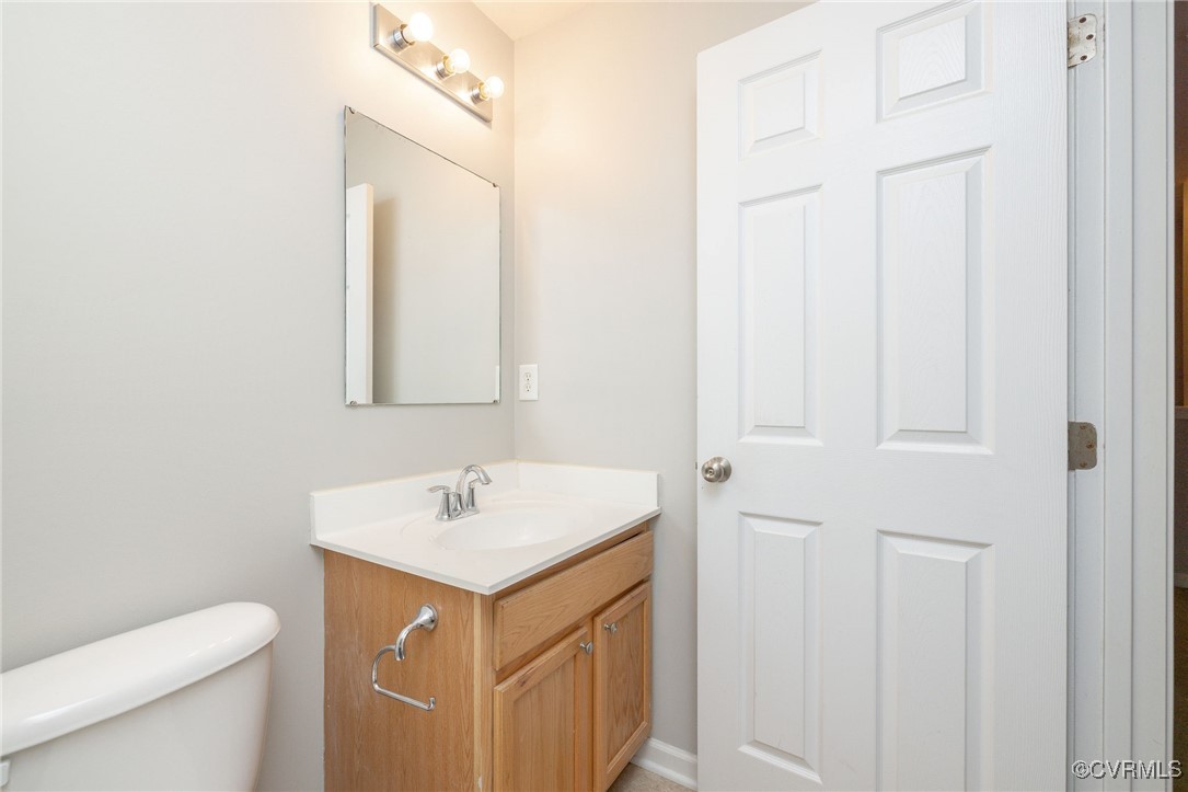 5125 Glenbeigh Road Richmond, VA 23234 - Photo 23 of 40 a bathroom with a sink toilet and mirror