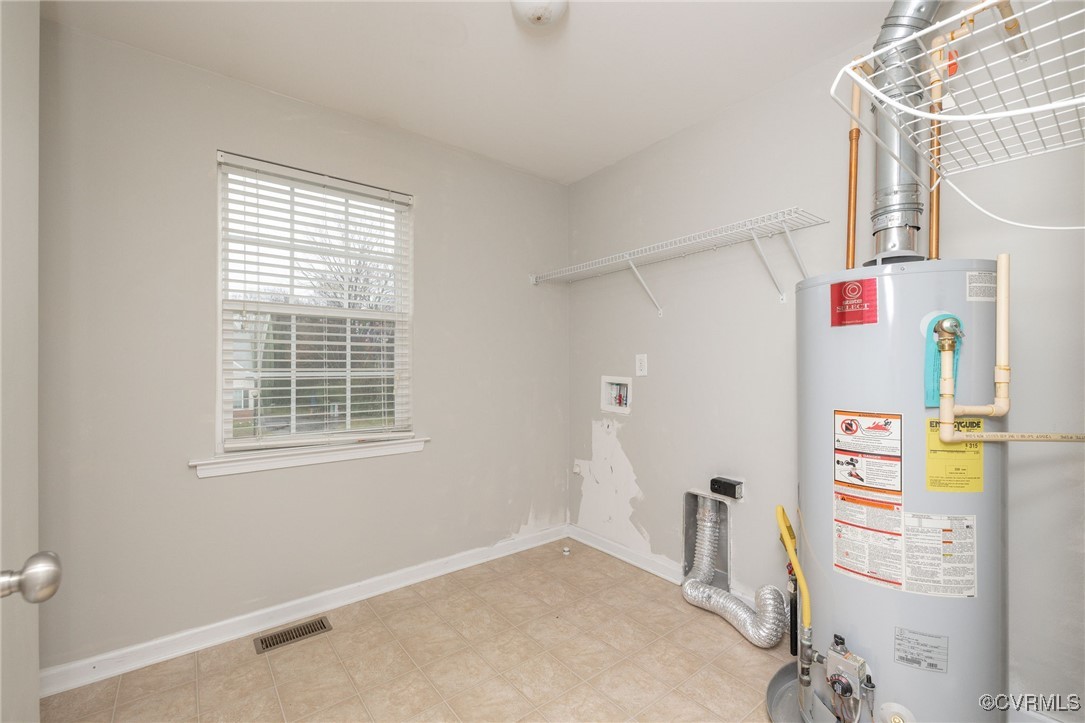 5125 Glenbeigh Road Richmond, VA 23234 - Photo 27 of 40 a view of hallway with window and refrigerator