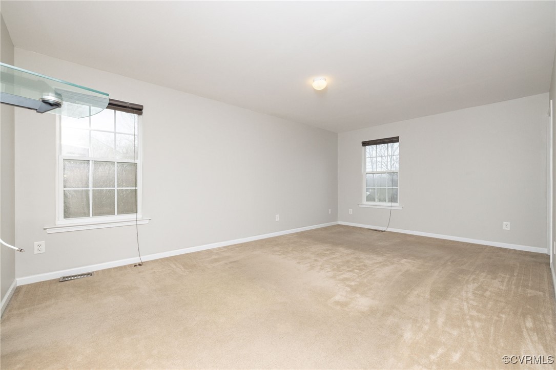 5125 Glenbeigh Road Richmond, VA 23234 - Photo 29 of 40 an empty room with windows