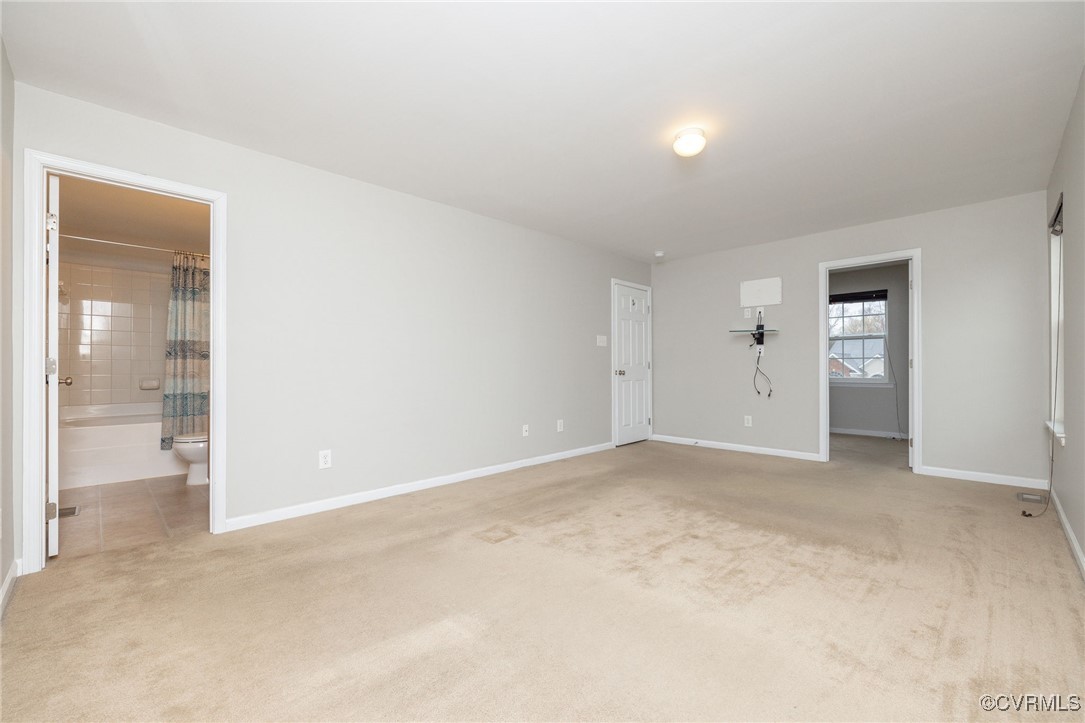 5125 Glenbeigh Road Richmond, VA 23234 - Photo 30 of 40 an empty room with closet and a bathroom