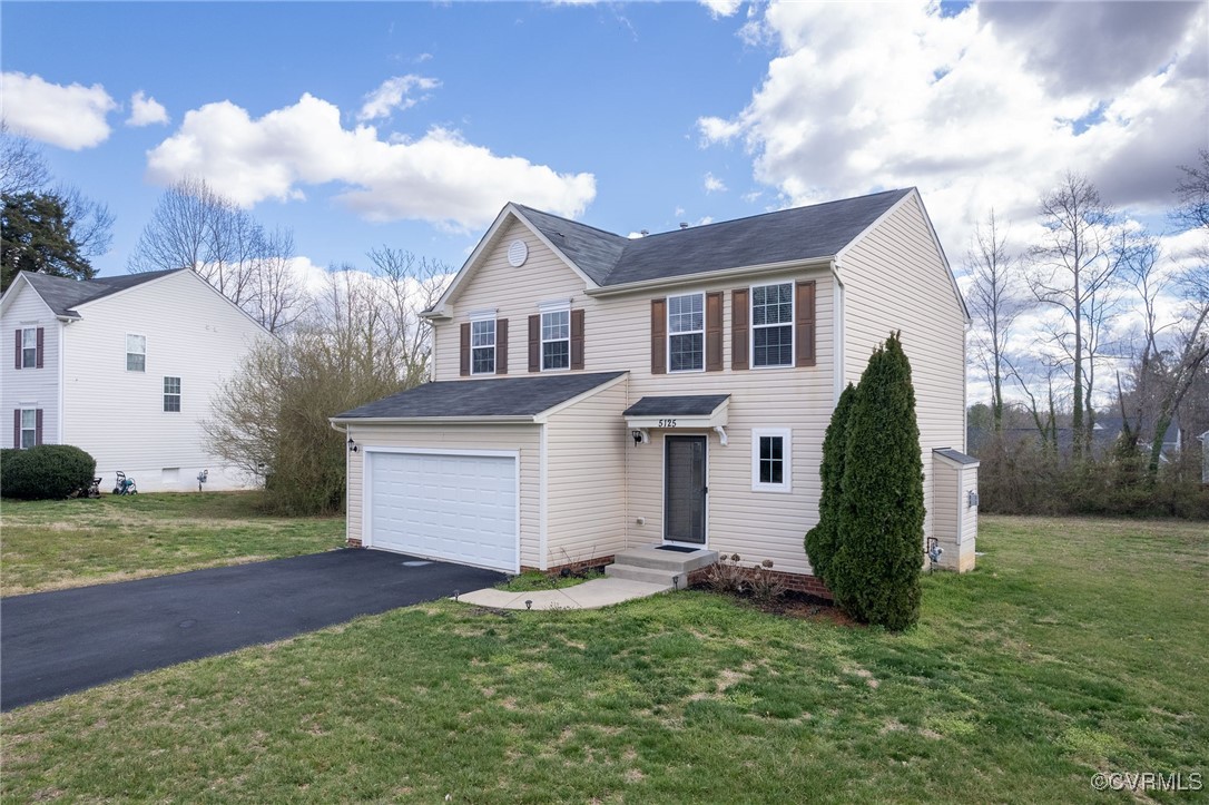 5125 Glenbeigh Road Richmond, VA 23234 - Photo 3 of 40 front view of a house with a yard
