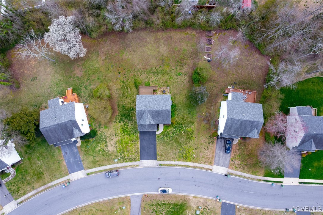 5125 Glenbeigh Road Richmond, VA 23234 - Photo 39 of 40 an aerial view of a house with a garden and a lake view
