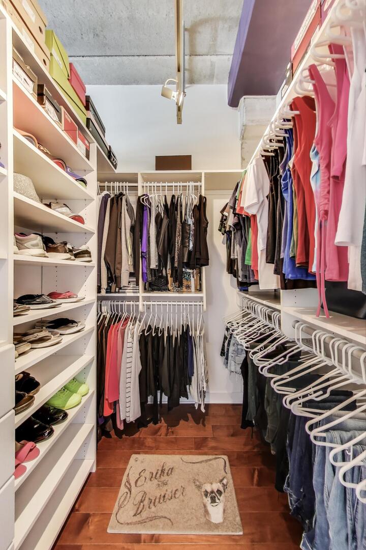 833 West 15th Place, Unit 606W Chicago, IL 60608 - Photo 17 of 47 a view of walk in closet with clothes and shoes