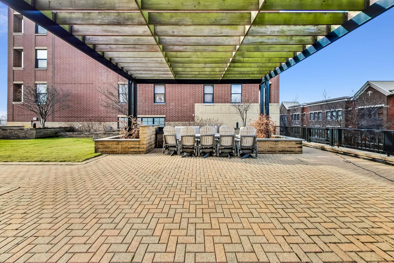 833 West 15th Place, Unit 606W Chicago, IL 60608 - Photo 34 of 47 a swimming pool with a patio outdoor seating and yard