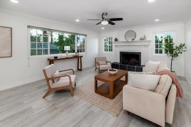 a living room with furniture and a fireplace