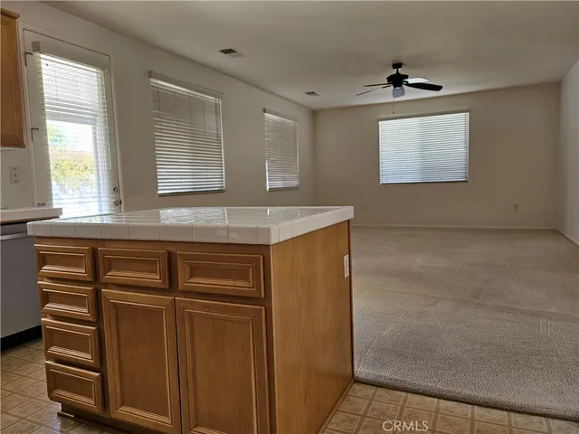 a view of cabinets and window