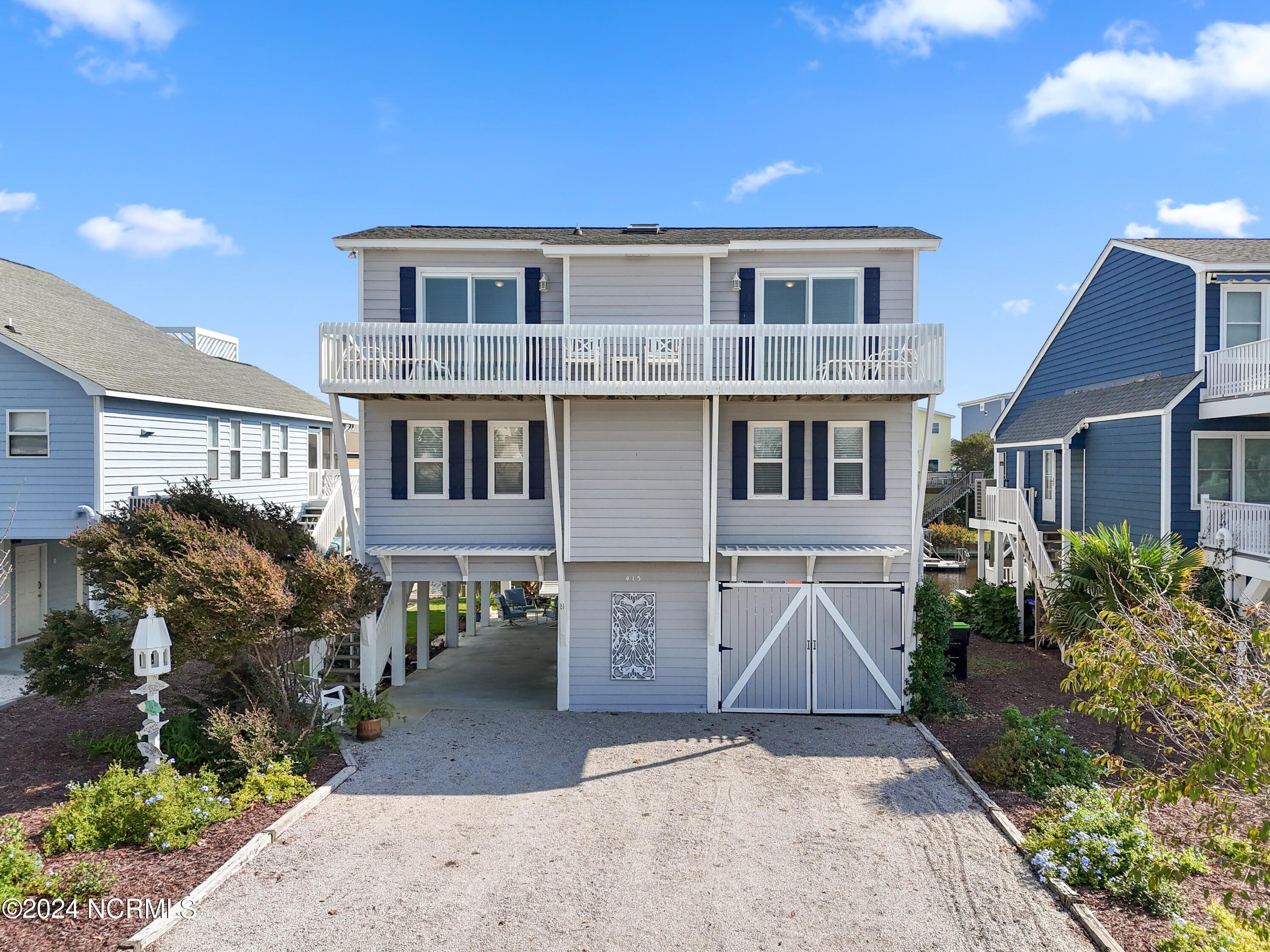 415 Sailfish Street Sunset Beach, NC 28468 - Photo 2 of 63 Enjoy the waterfront lifestyle with this canal front home on Sunset Beach.