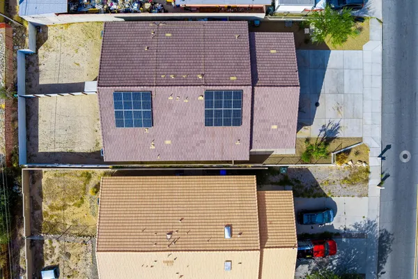 an aerial view of a house with a ocean view