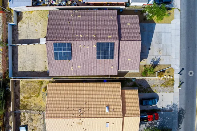 an aerial view of a house with a ocean view