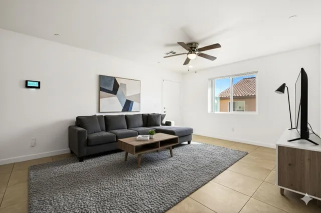 a view of a kitchen with a sink and a refrigerator
