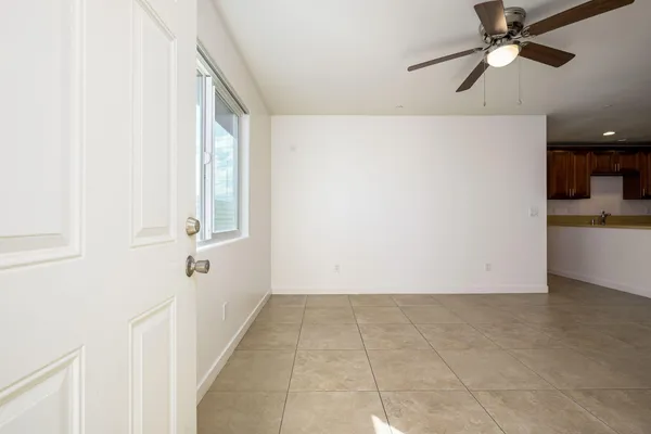 a view of an empty room with windows