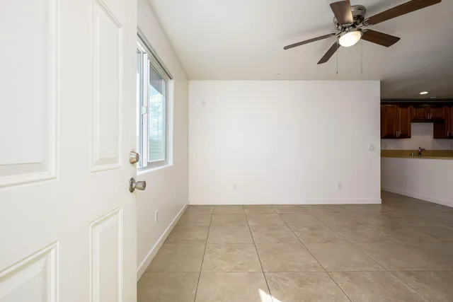 a view of an empty room with windows
