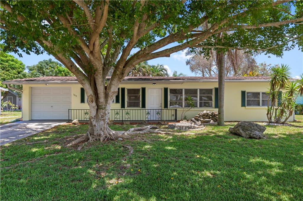 369 Hillview Road Venice, FL 34293 - Photo 1 of 1 front view of a house with a yard