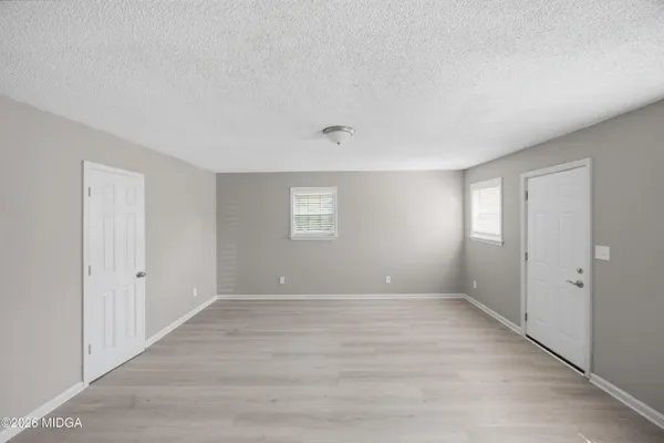 a view of an empty room with a window