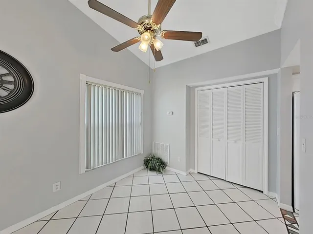 a view of an entryway with a chandelier fan