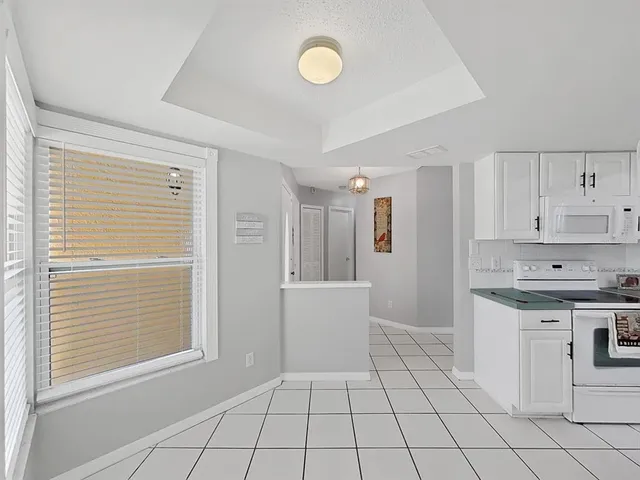 a kitchen with a cabinets and appliances
