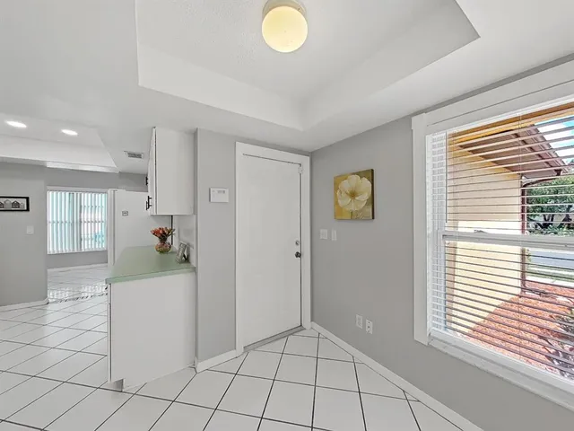 a view of an empty room and a window