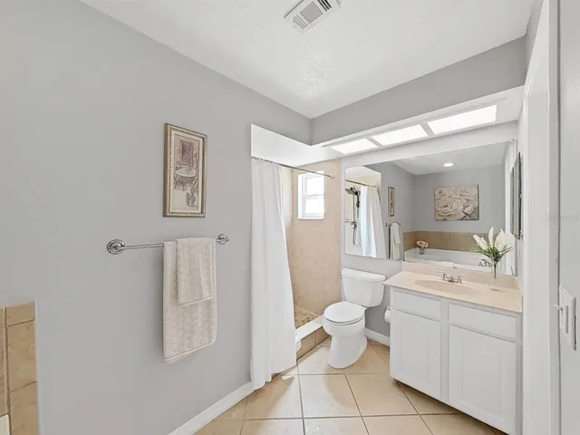 a bathroom with a bathtub and shower