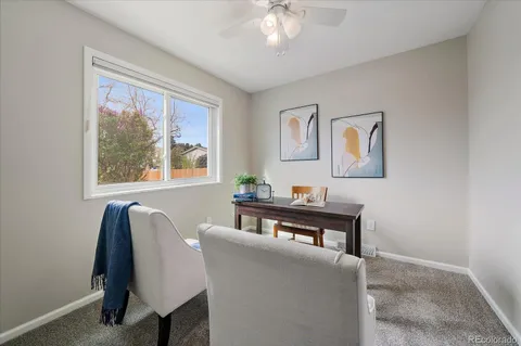 a view of a livingroom with furniture and window