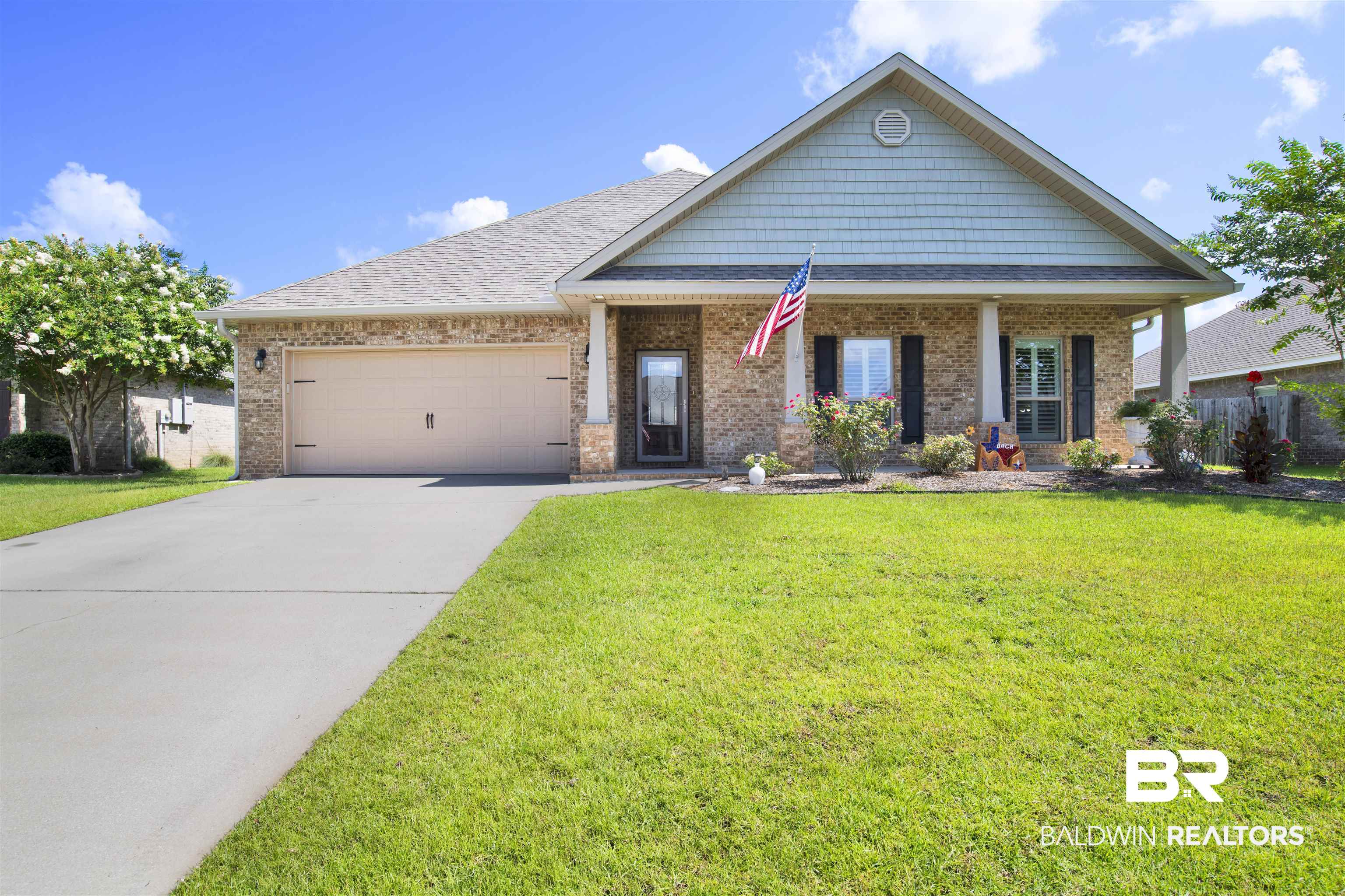 278 Silo Loop Fairhope, AL 36532 - Photo 1 of 26 Craftsman house with an attached garage, driveway, brick siding, and a front yard