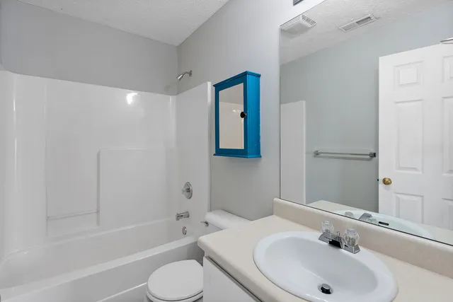 a bathroom with a sink and a bathtub
