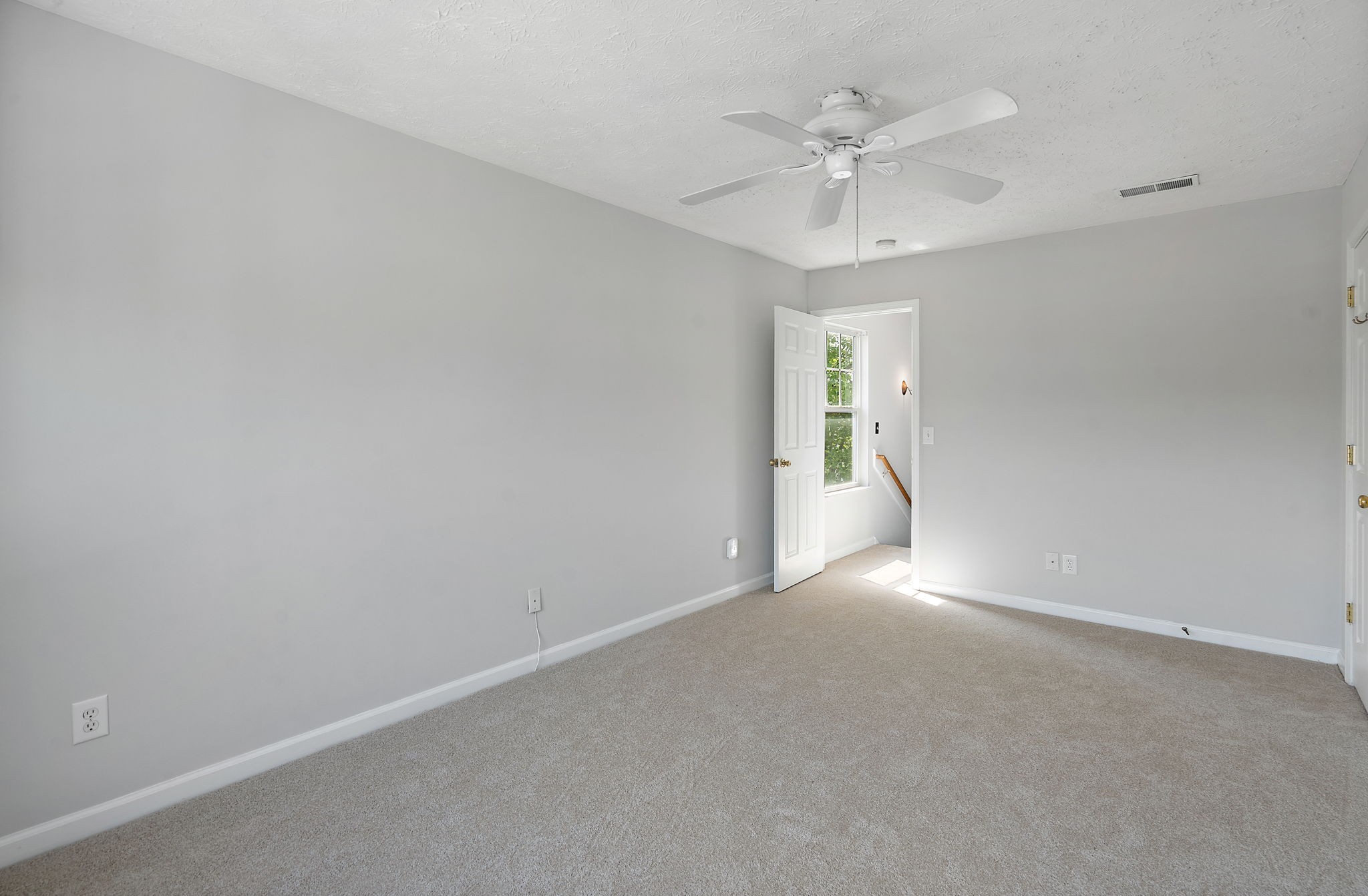 3253 Harpeth Springs Drive Nashville, TN 37221 - Photo 14 of 21 an empty room with a chandelier fan and windows