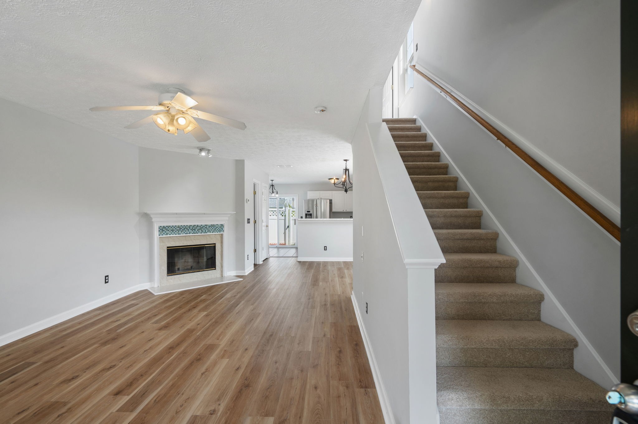 3253 Harpeth Springs Drive Nashville, TN 37221 - Photo 2 of 21 a view of a livingroom with wooden floor a ceiling fan and staircase