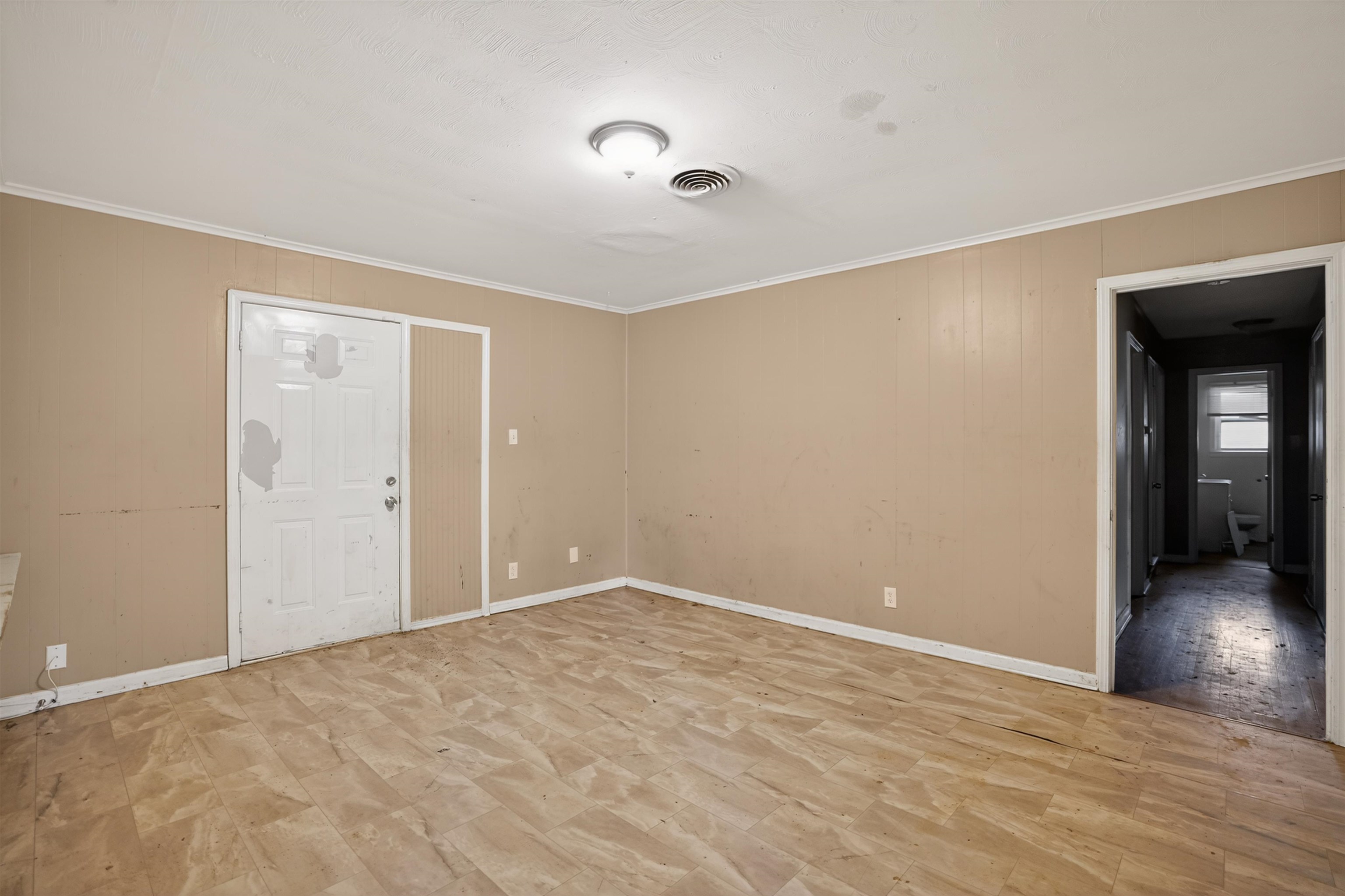 1890 Pennel Road Memphis, TN 38116 - Photo 17 of 25 Spacious room featuring wood-finish flooring, light tan paneled walls, and a recessed ceiling light fixture