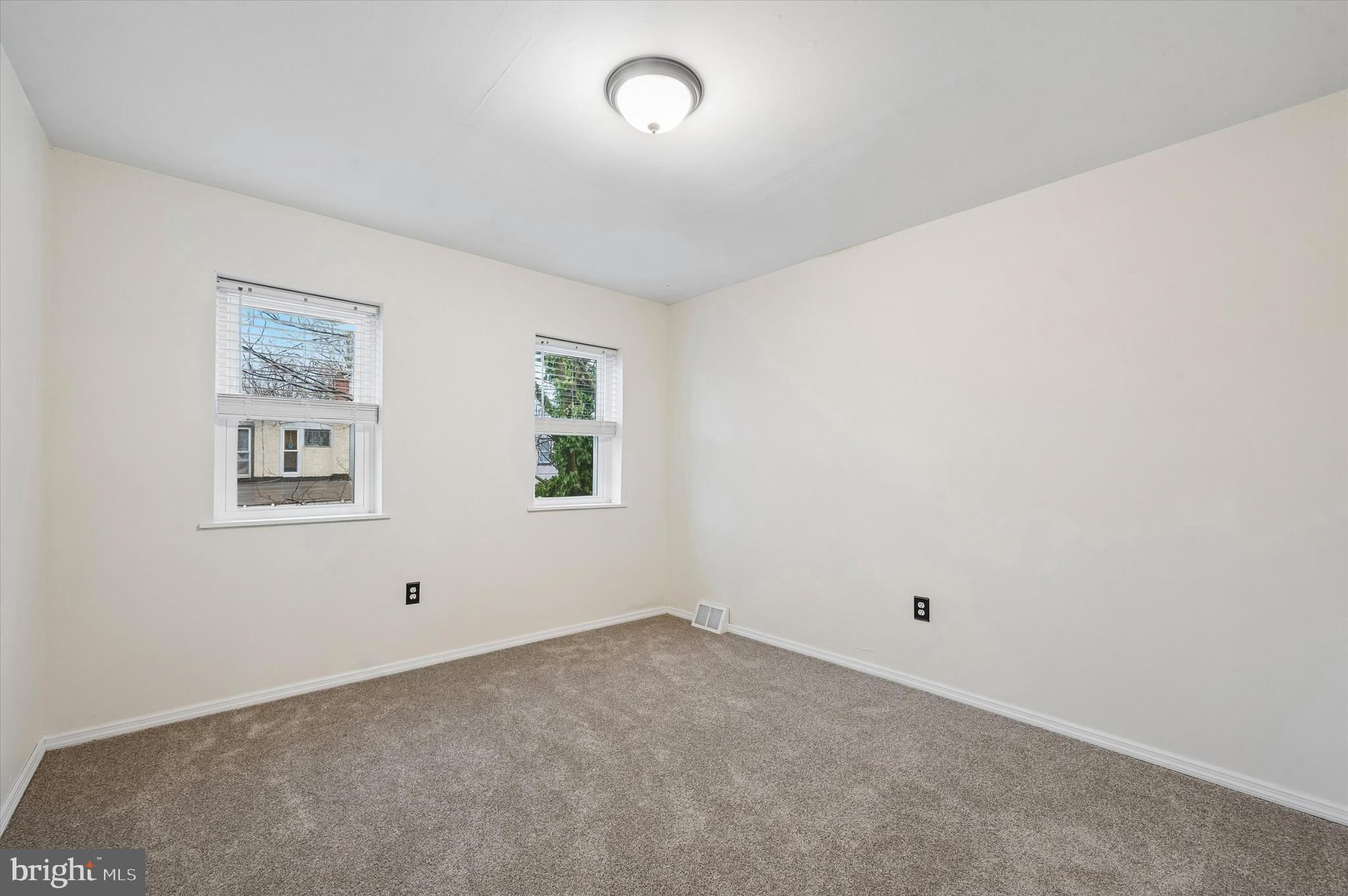 6129 Spruce Street Philadelphia, PA 19139 - Photo 15 of 18 an empty room with windows
