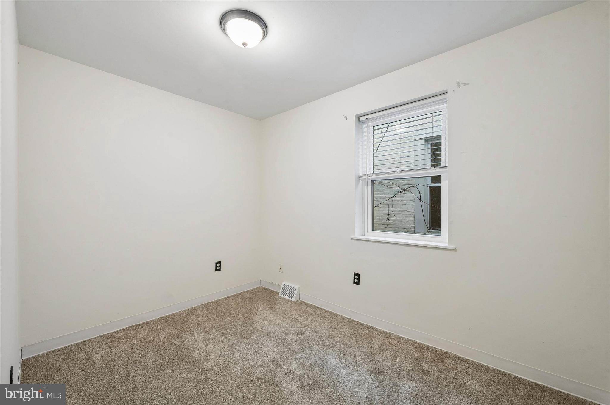 6129 Spruce Street Philadelphia, PA 19139 - Photo 16 of 18 an empty room with a window
