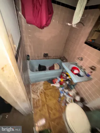 a bathroom with a sink toilet and vanity