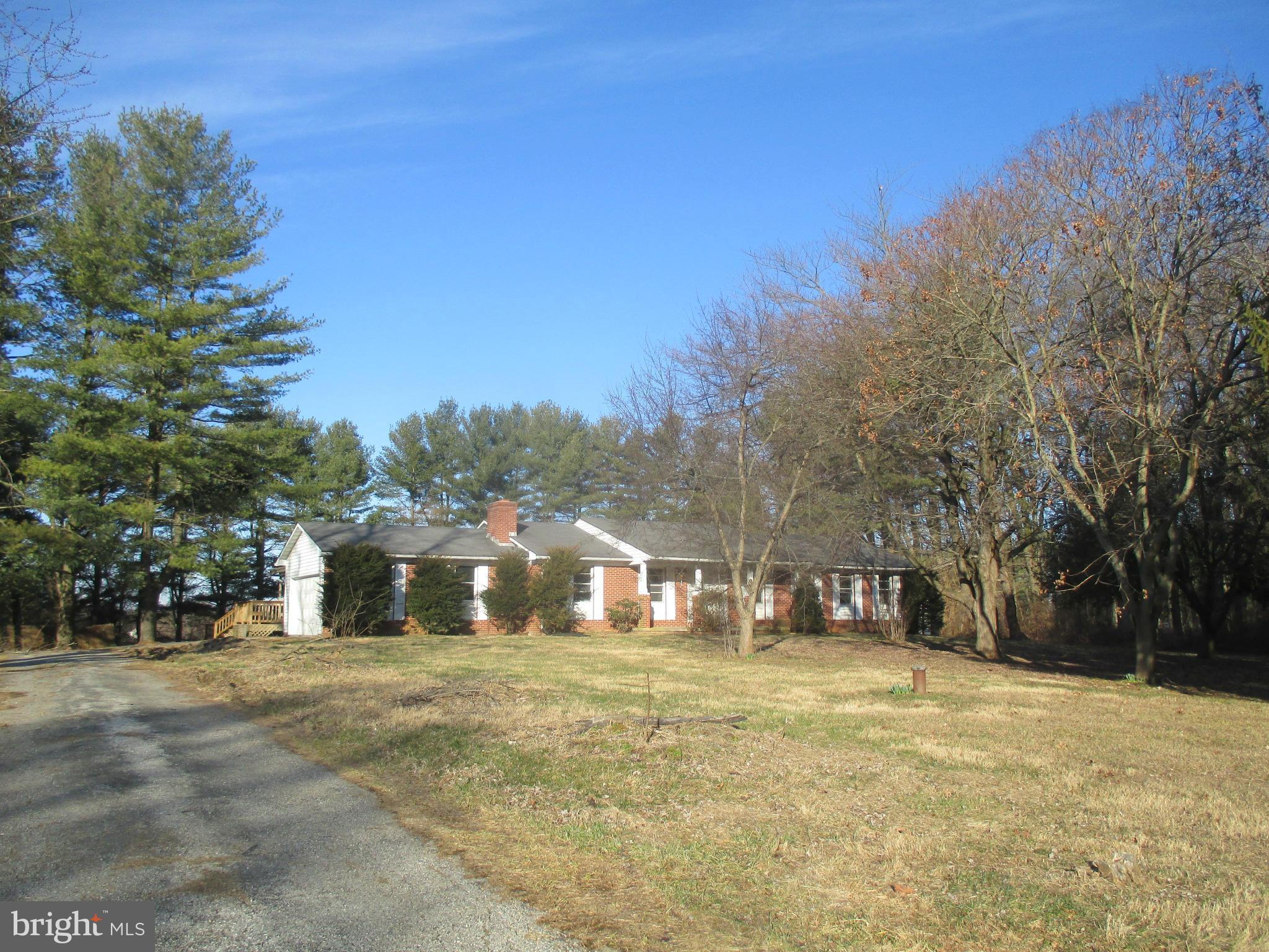 19706 Trunk Road White Hall, MD 21161 - Photo 1 of 19 a front view of a house with a yard