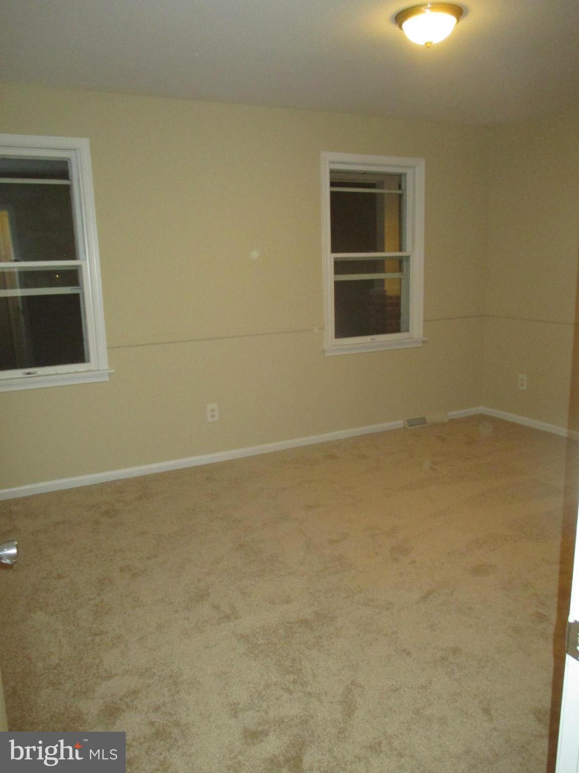 19706 Trunk Road White Hall, MD 21161 - Photo 12 of 19 an empty room with a window