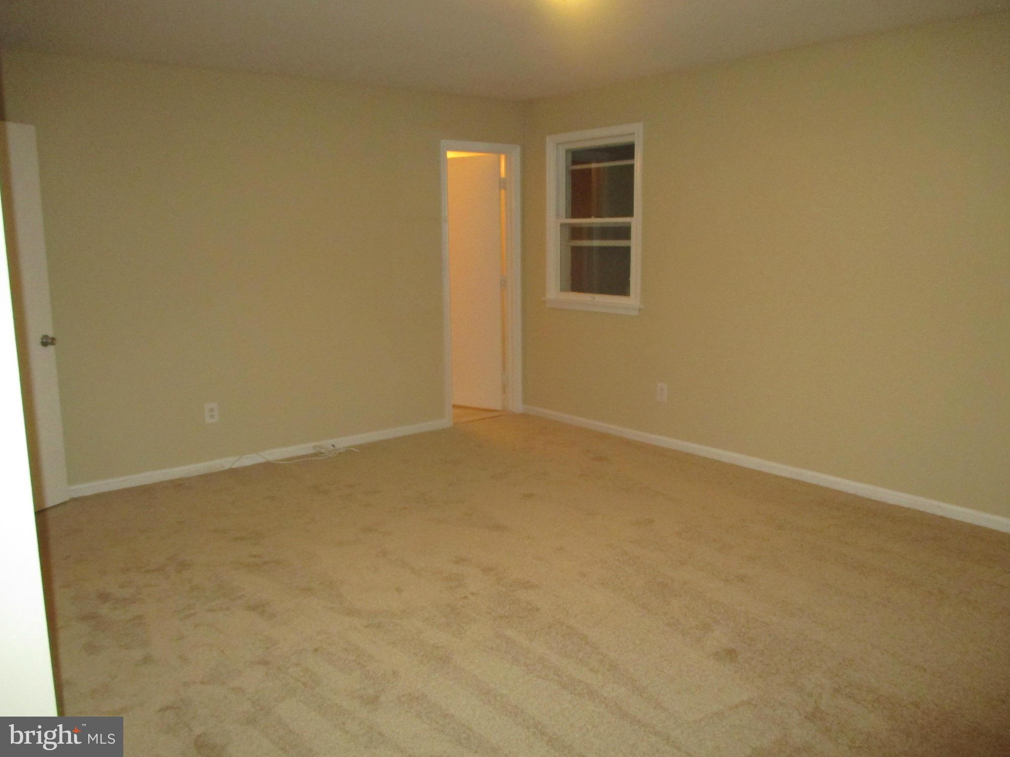 19706 Trunk Road White Hall, MD 21161 - Photo 18 of 19 en empty room with windows