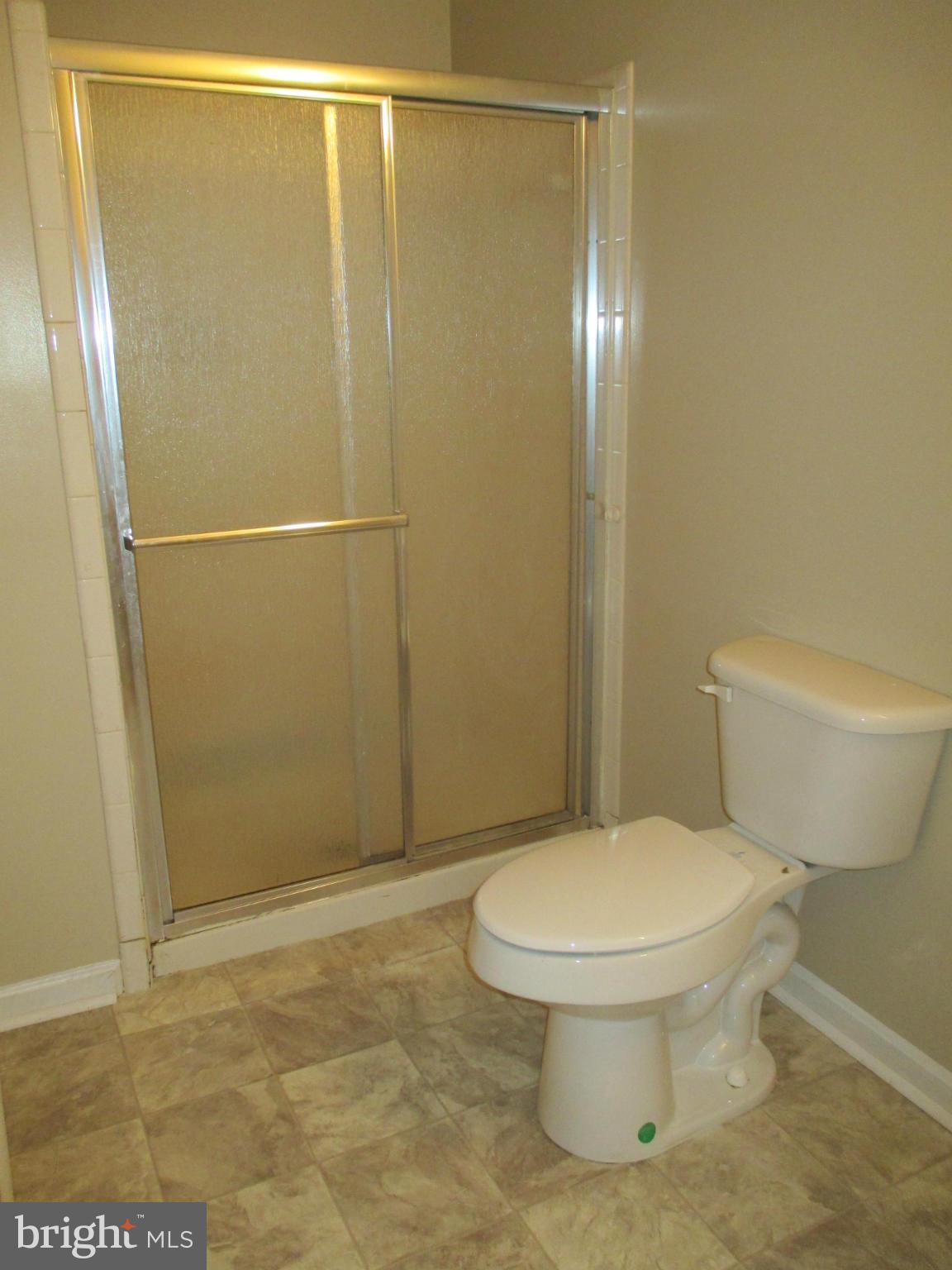 19706 Trunk Road White Hall, MD 21161 - Photo 19 of 19 a bathroom with a toilet and a shower