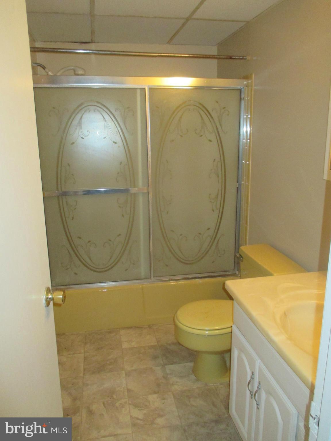 19706 Trunk Road White Hall, MD 21161 - Photo 6 of 19 a bathroom with a toilet a sink and a shower
