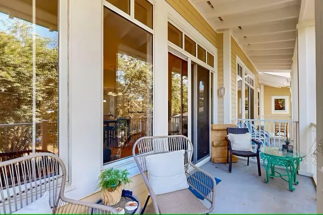 a view of a patio with couches and a potted plant