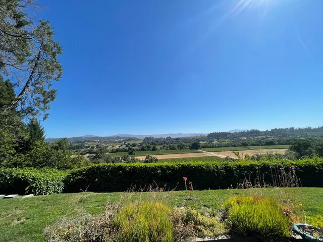 a view of outdoor space with yard and lake view