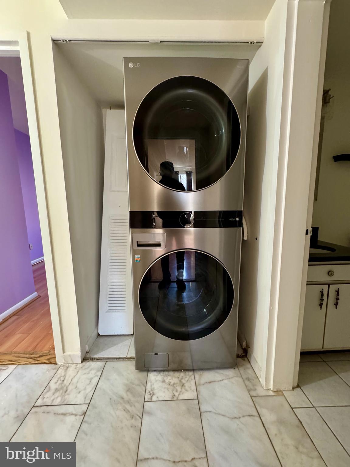 2247 Castle Rock Square, Unit 1B Reston, VA 20191 - Photo 12 of 26 a utility room with a washer and dryer
